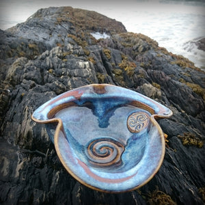 Seamair pottery bowl on rock background